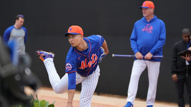 Feb 19, 2024; Port St. Lucie, FL, USA; New York Mets starting pitcher Kodai Senga (34) warms-up during workouts at spring training.